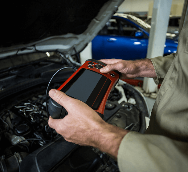 mechanic-pouring-oil-into-car-engine