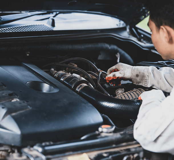 mechanic-pouring-oil-into-car-engine